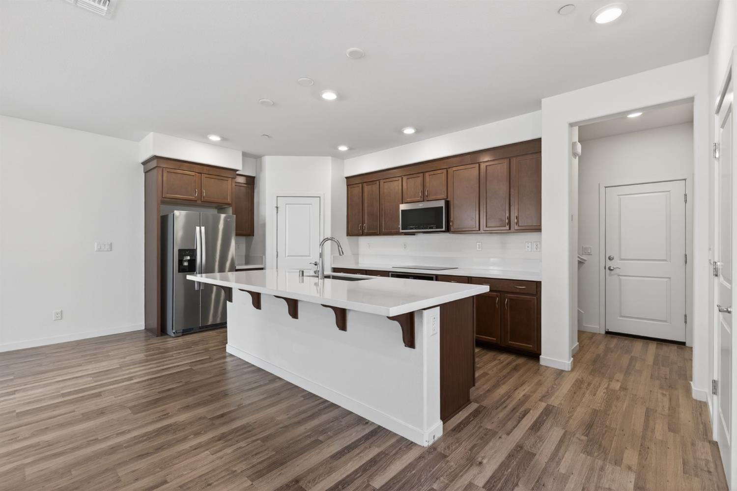 3080 Windwalker Walk Sacramento, CA 95833 - Photo 16 of 61 a kitchen with stainless steel appliances granite countertop a stove and a sink