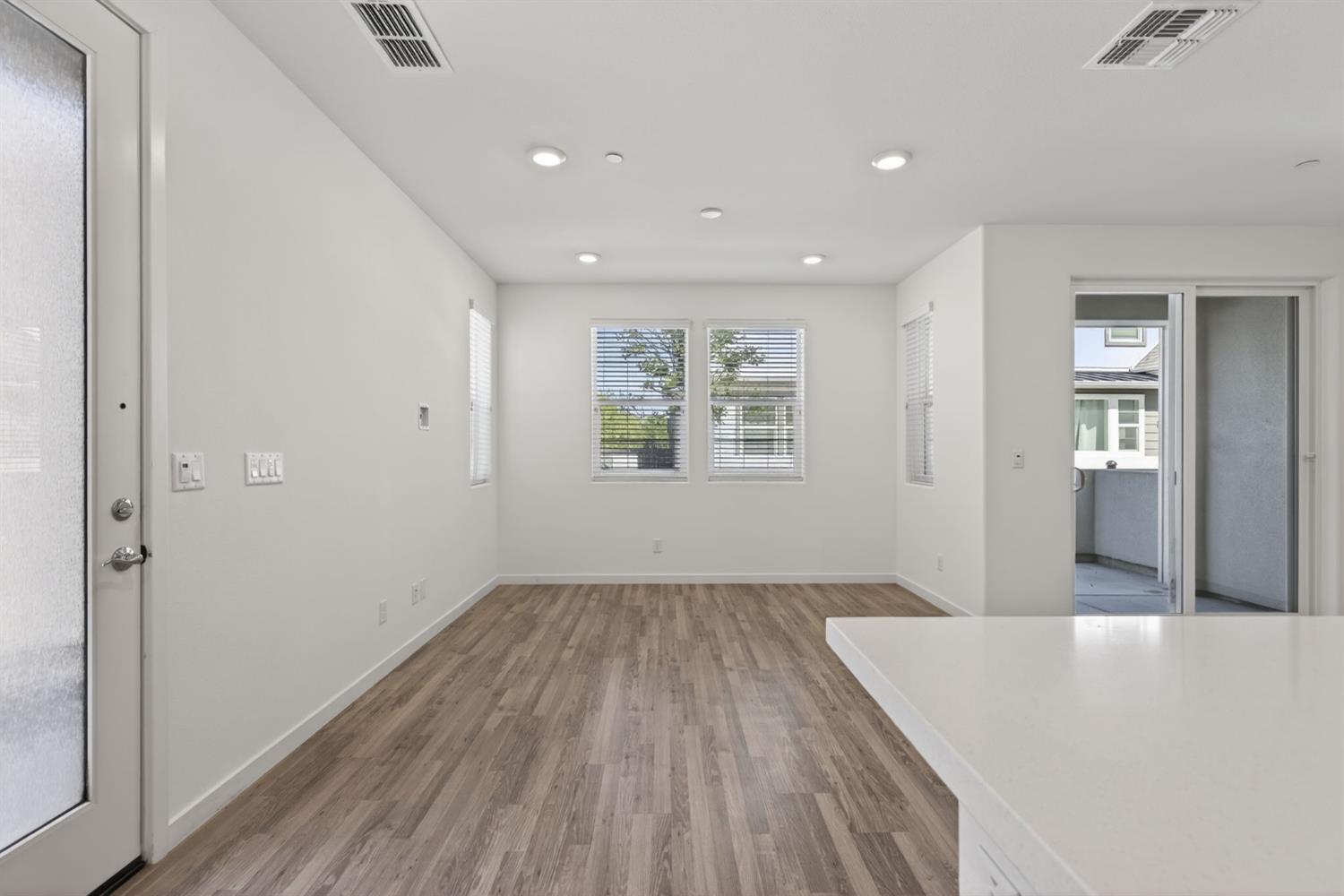 3080 Windwalker Walk Sacramento, CA 95833 - Photo 20 of 61 wooden floor in an empty room with a window