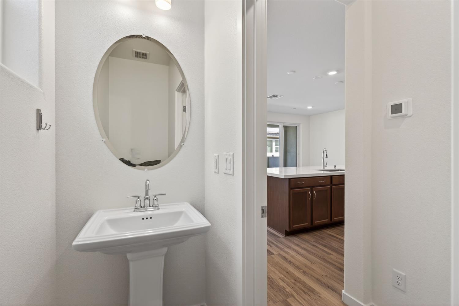 3080 Windwalker Walk Sacramento, CA 95833 - Photo 25 of 61 a bathroom with a sink and a mirror