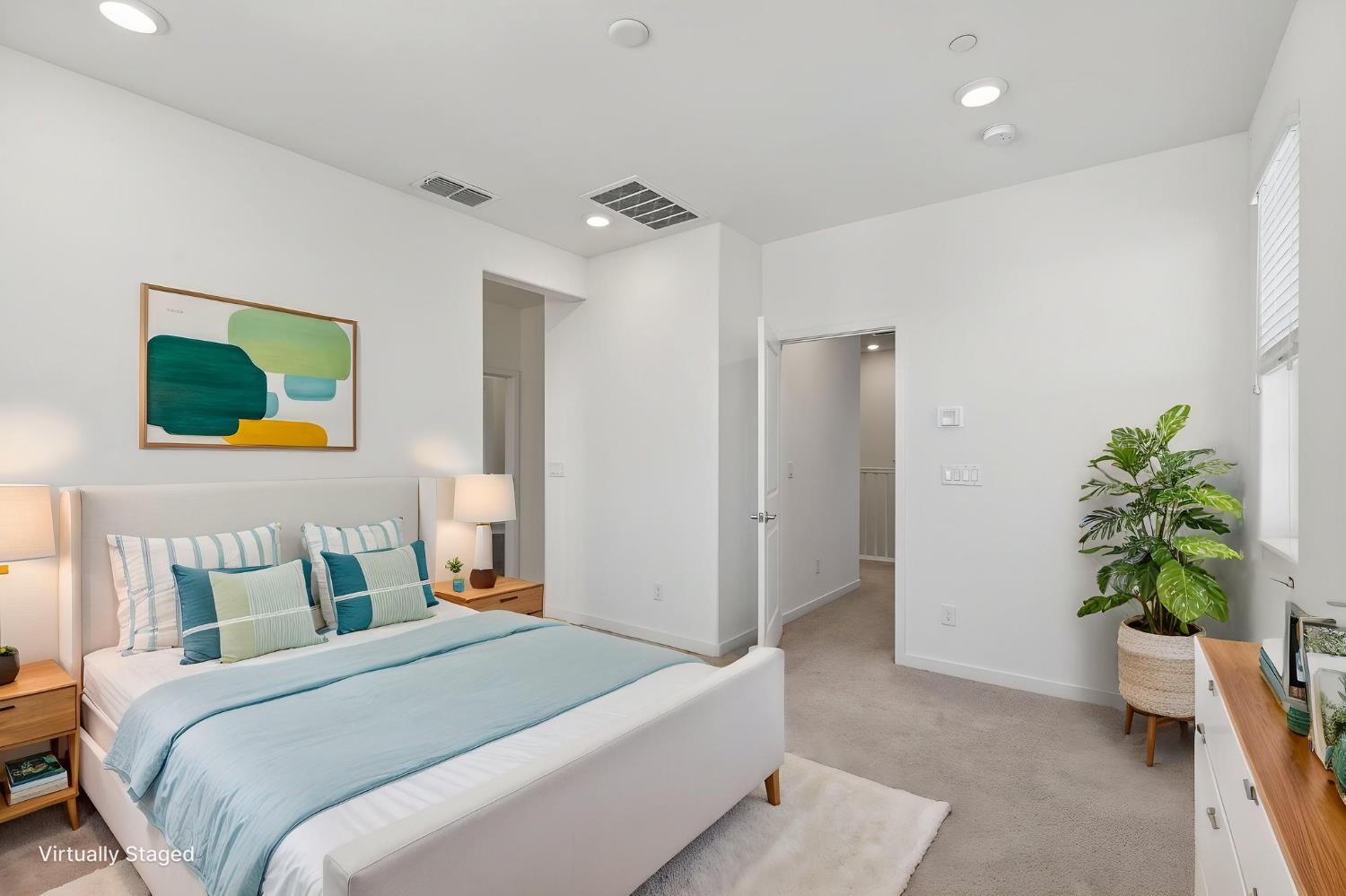 3080 Windwalker Walk Sacramento, CA 95833 - Photo 30 of 61 a bedroom with a bed and a potted plant