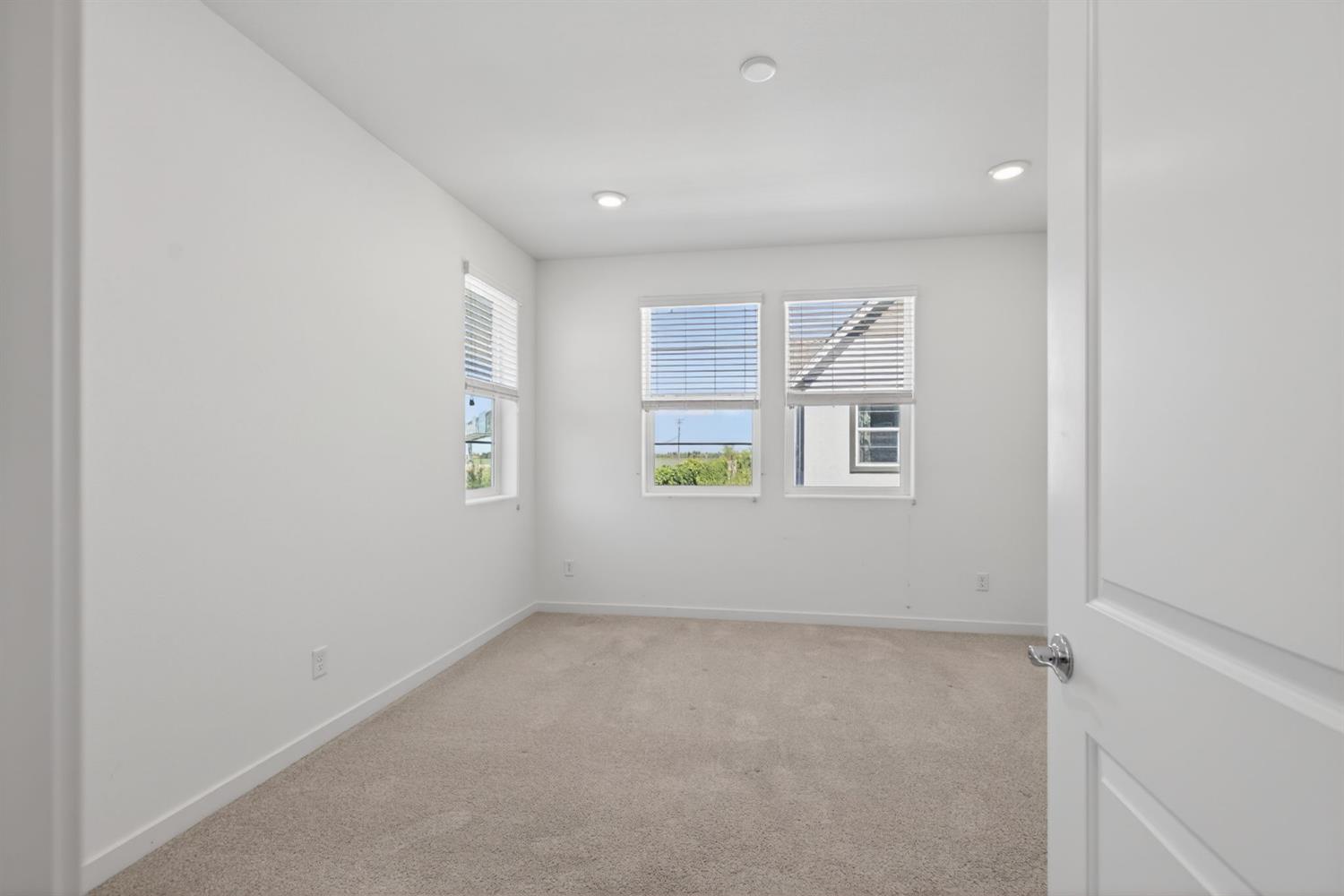3080 Windwalker Walk Sacramento, CA 95833 - Photo 32 of 61 an empty room with windows