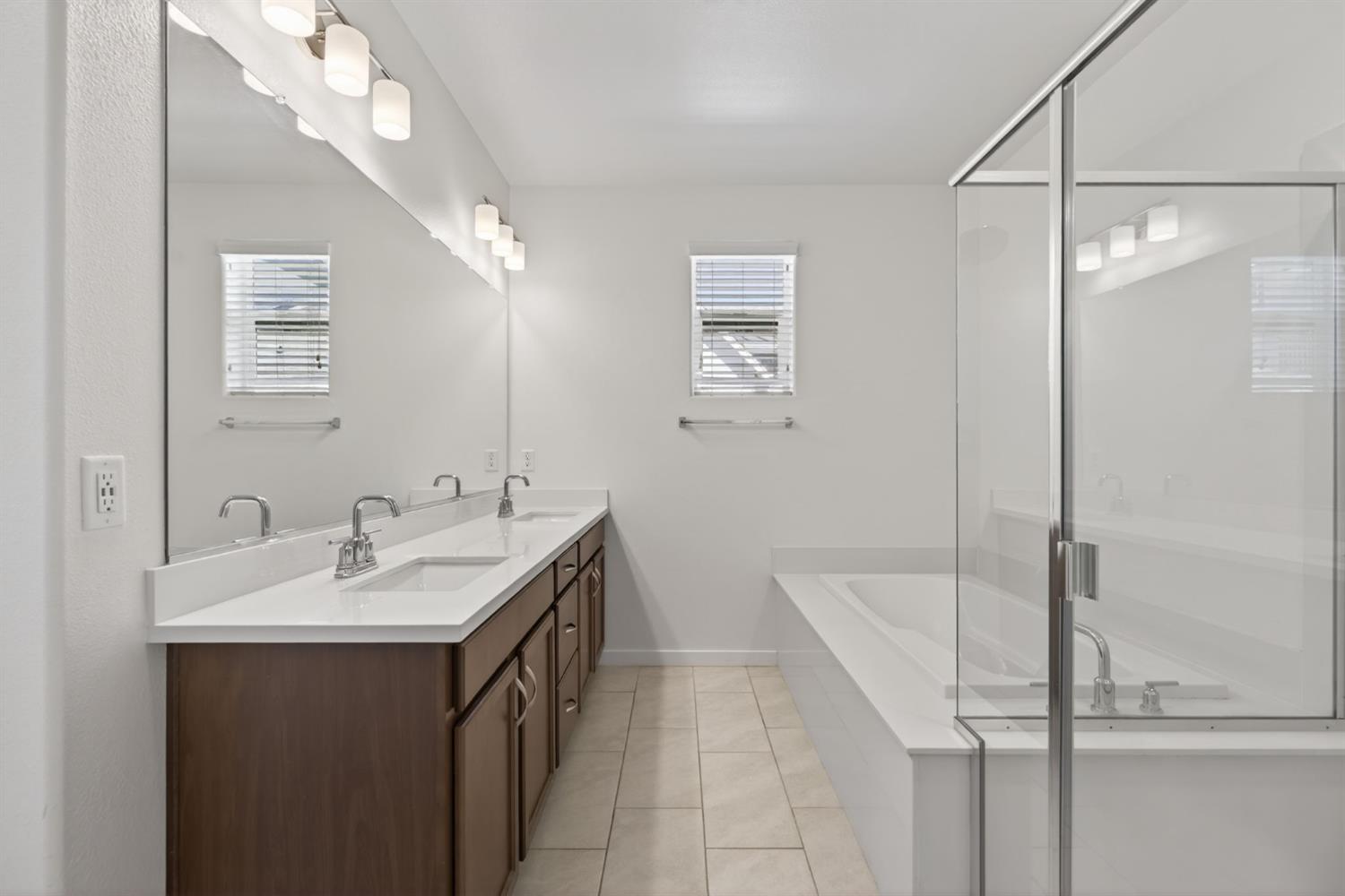 3080 Windwalker Walk Sacramento, CA 95833 - Photo 34 of 61 a bathroom with a sink a mirror and a shower