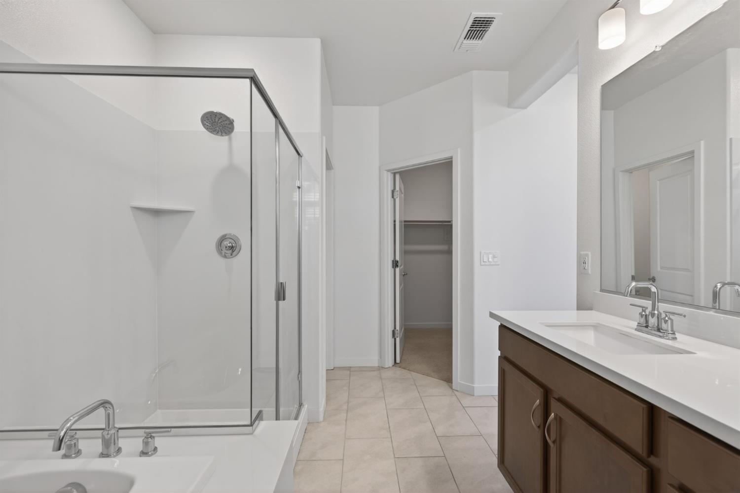 3080 Windwalker Walk Sacramento, CA 95833 - Photo 35 of 61 a bathroom with a sink and a mirror