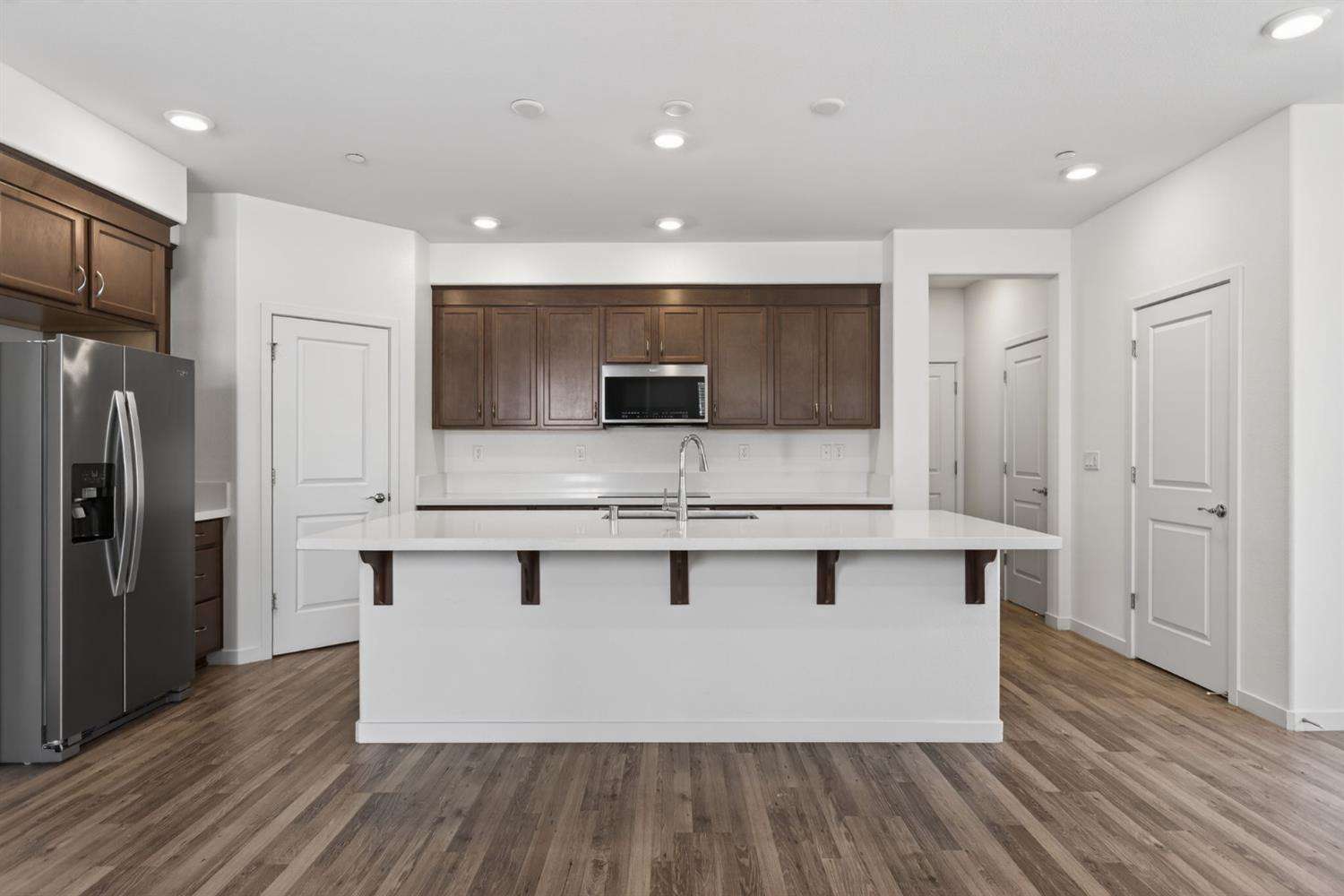 3080 Windwalker Walk Sacramento, CA 95833 - Photo 9 of 61 a view of kitchen with sink refrigerator and microwave