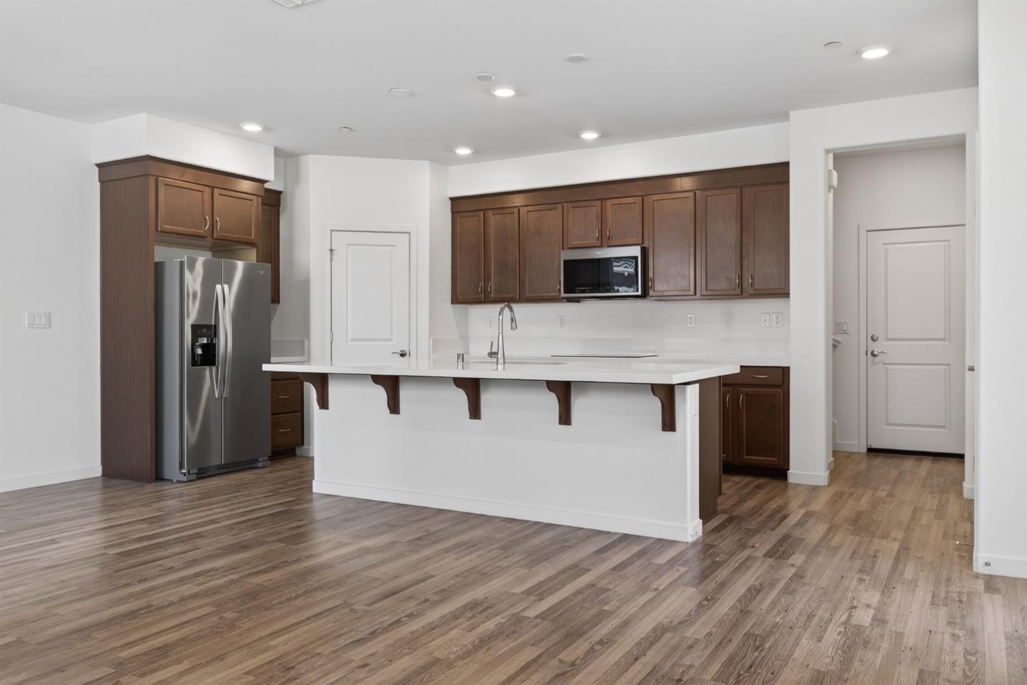 3080 Windwalker Walk Sacramento, CA 95833 - Photo 10 of 61 a kitchen with stainless steel appliances granite countertop a refrigerator and a stove