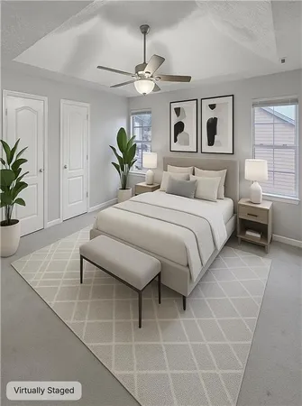 a bedroom with a bed and a potted plant