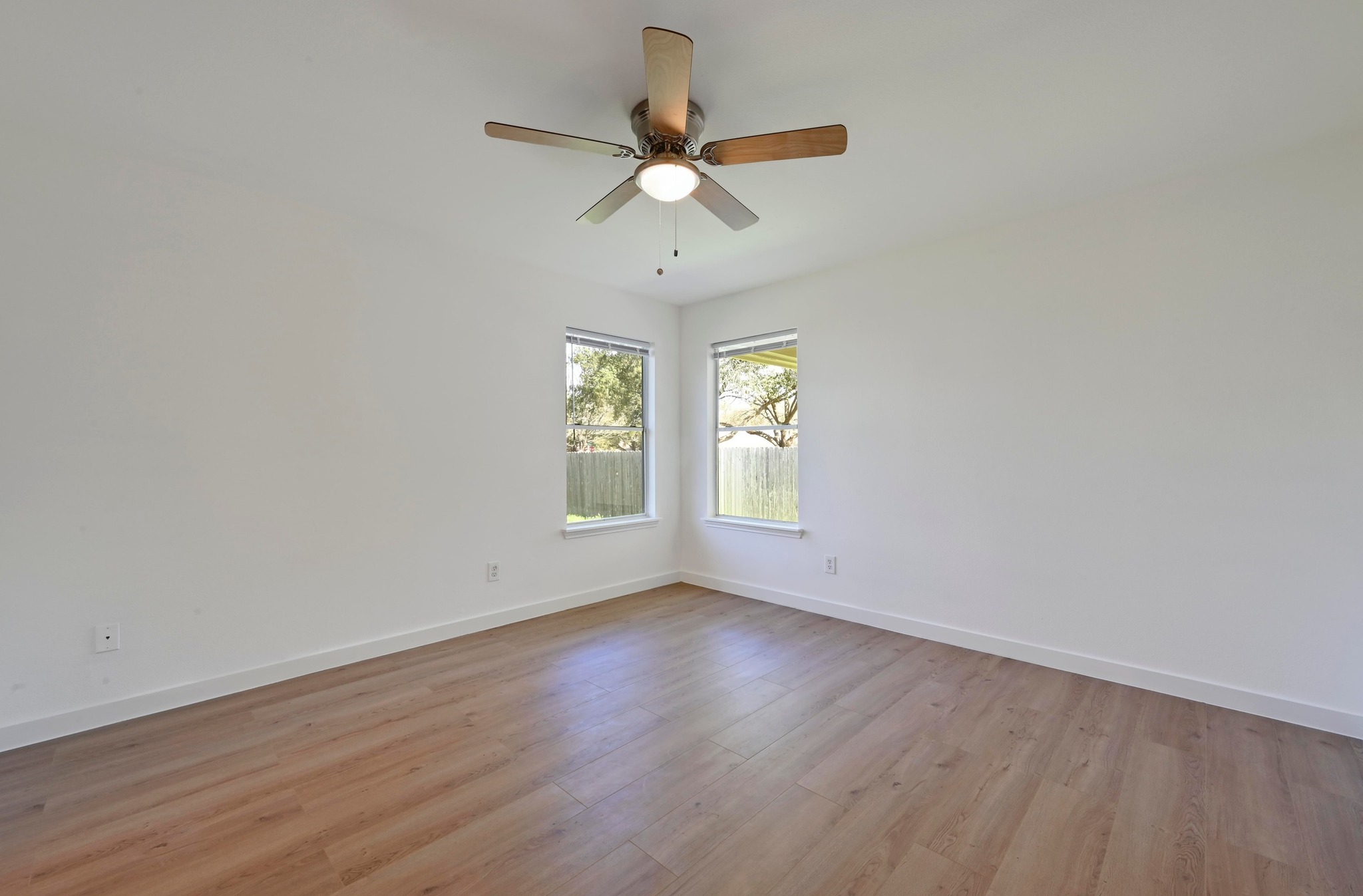 11106 Franklins Tale Loop Austin, TX 78748 - Photo 14 of 25 Unfurnished room with light wood finished floors and a ceiling fan