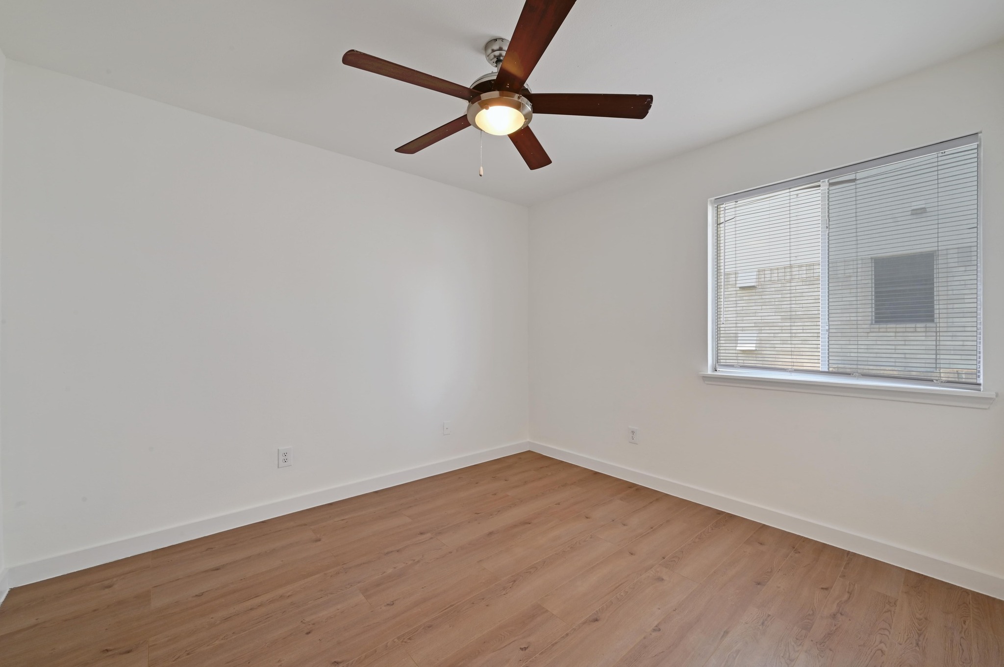 11106 Franklins Tale Loop Austin, TX 78748 - Photo 19 of 25 Unfurnished room with light wood-style flooring and ceiling fan