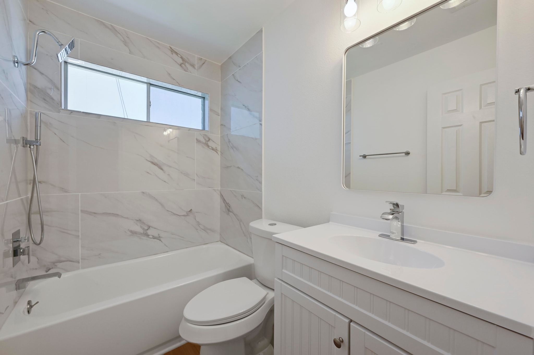 11106 Franklins Tale Loop Austin, TX 78748 - Photo 20 of 25 Full bath with vanity and a combined bath / shower with marble appearance