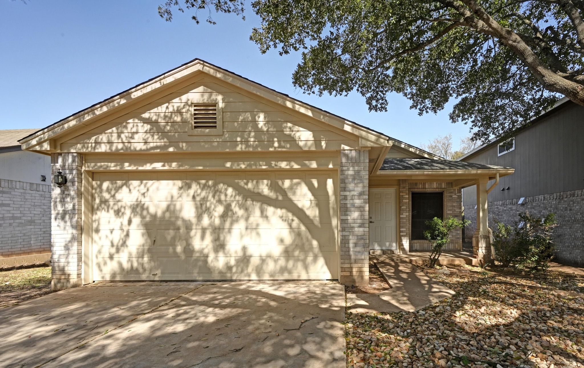 11106 Franklins Tale Loop Austin, TX 78748 - Photo 3 of 25 View of front facade with a garage, brick siding, driveway, and a patio