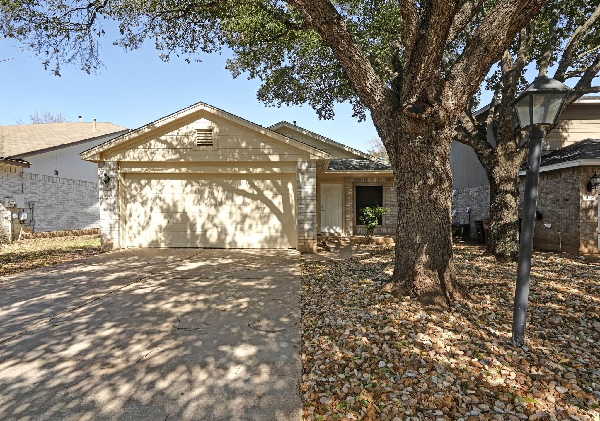 11106 Franklins Tale Loop Austin, TX 78748 - Photo 4 of 25 Ranch-style house with an attached garage, driveway, and brick siding