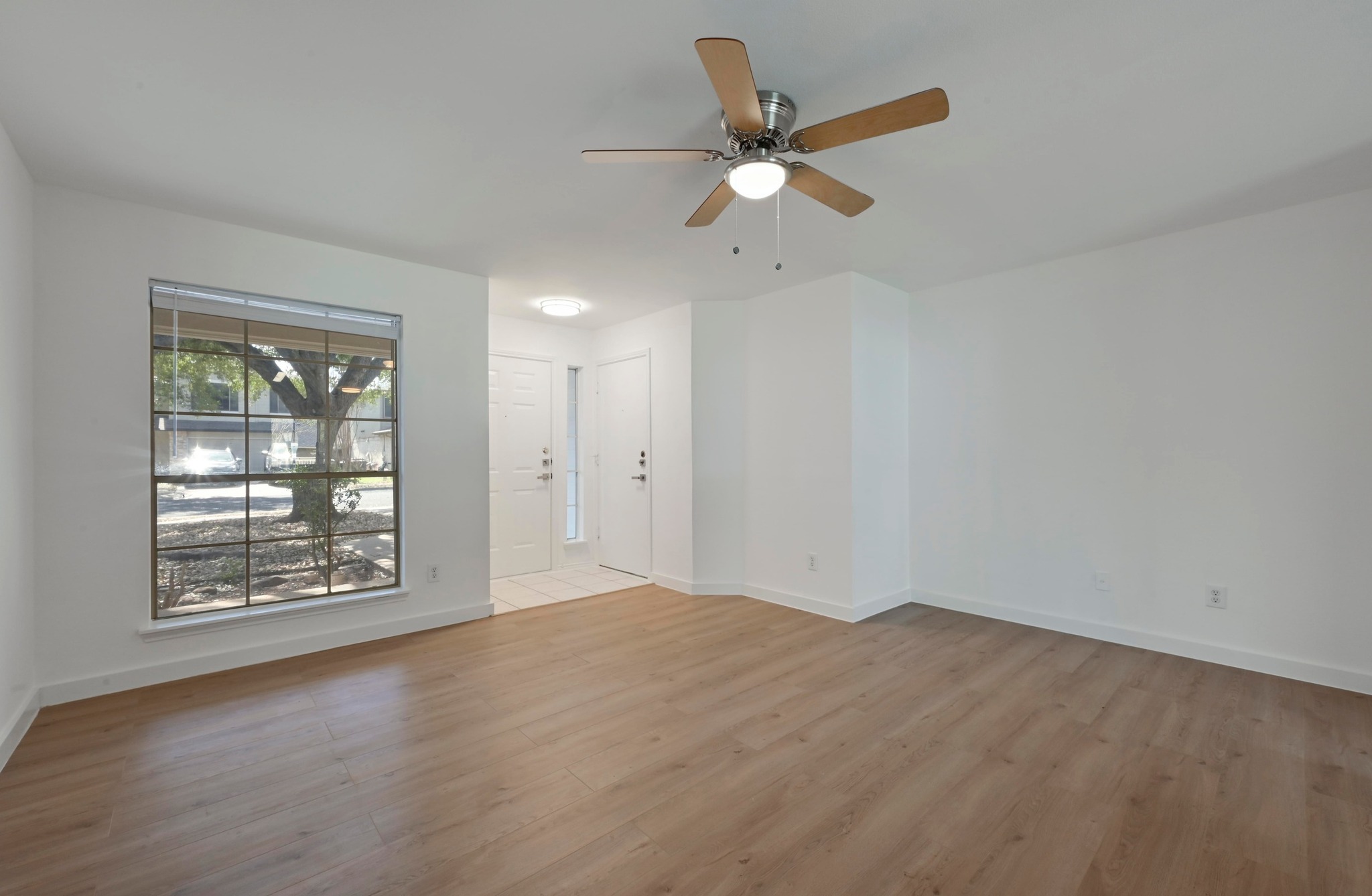 11106 Franklins Tale Loop Austin, TX 78748 - Photo 8 of 25 Unfurnished room featuring a ceiling fan and light wood finished floors