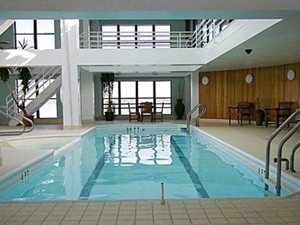 an open area with furniture and a large window