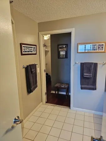 a view of kitchen with furniture and a refrigerator