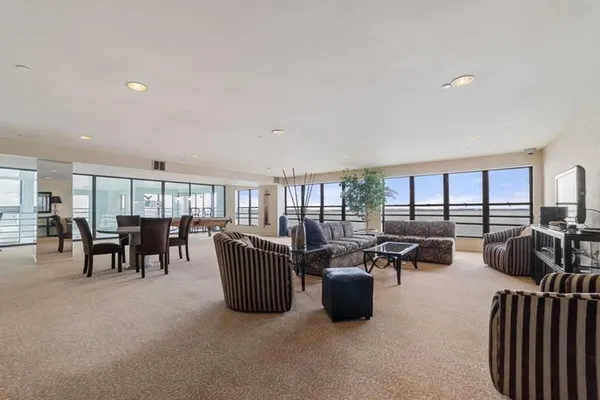 a living room with furniture and a table