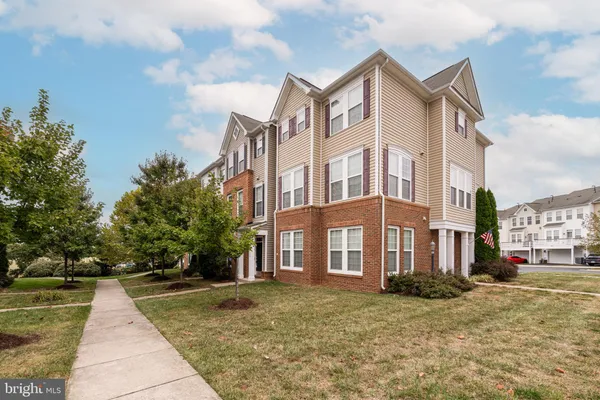 a view of a building with a yard