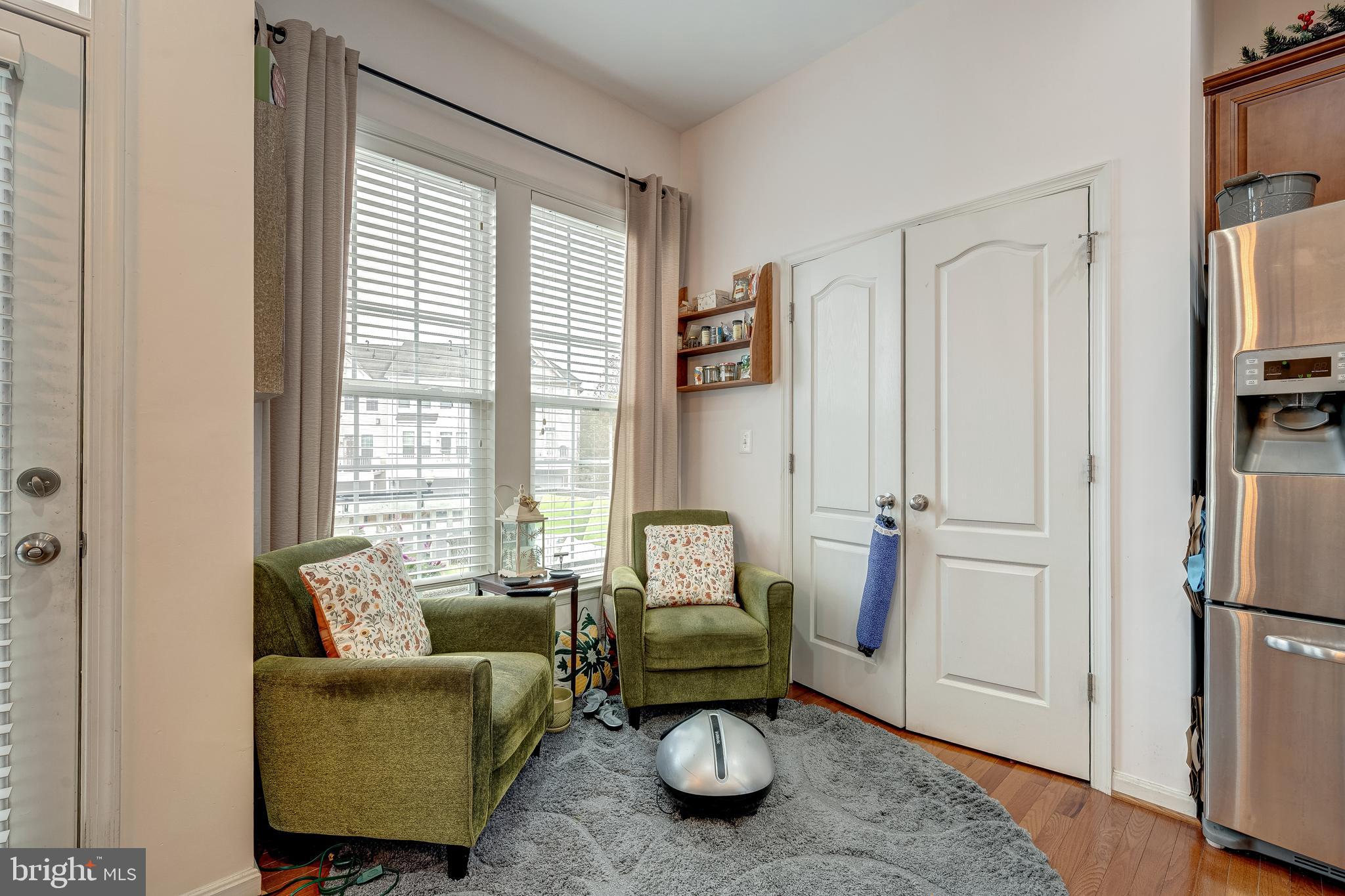 22644 Amberjack Square Brambleton, VA 20148 - Photo 13 of 34 a living room with furniture and a window