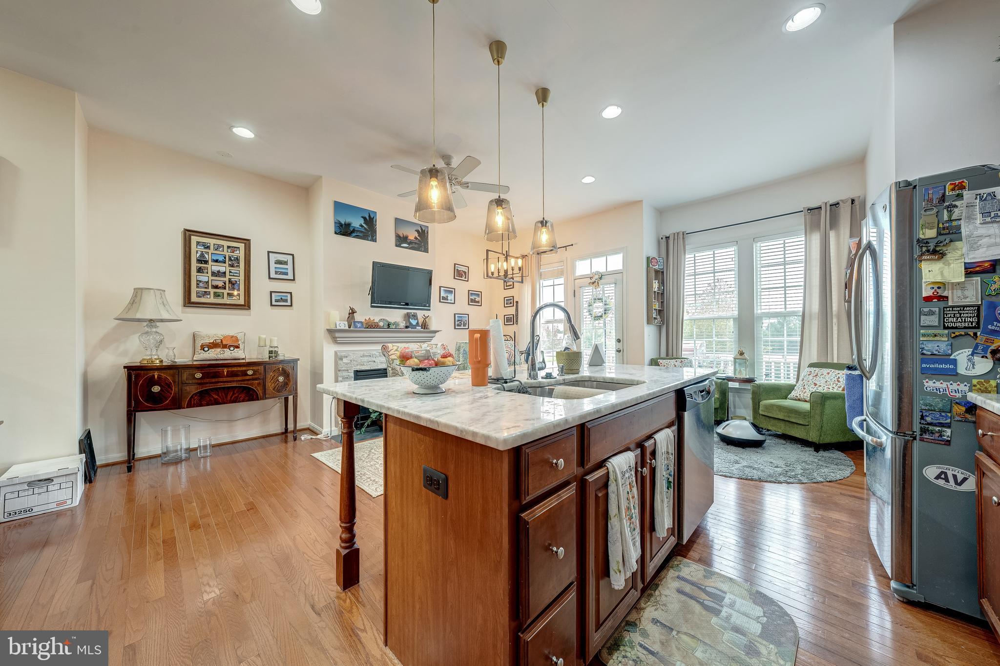 22644 Amberjack Square Brambleton, VA 20148 - Photo 18 of 34 a kitchen with stove and wooden floor