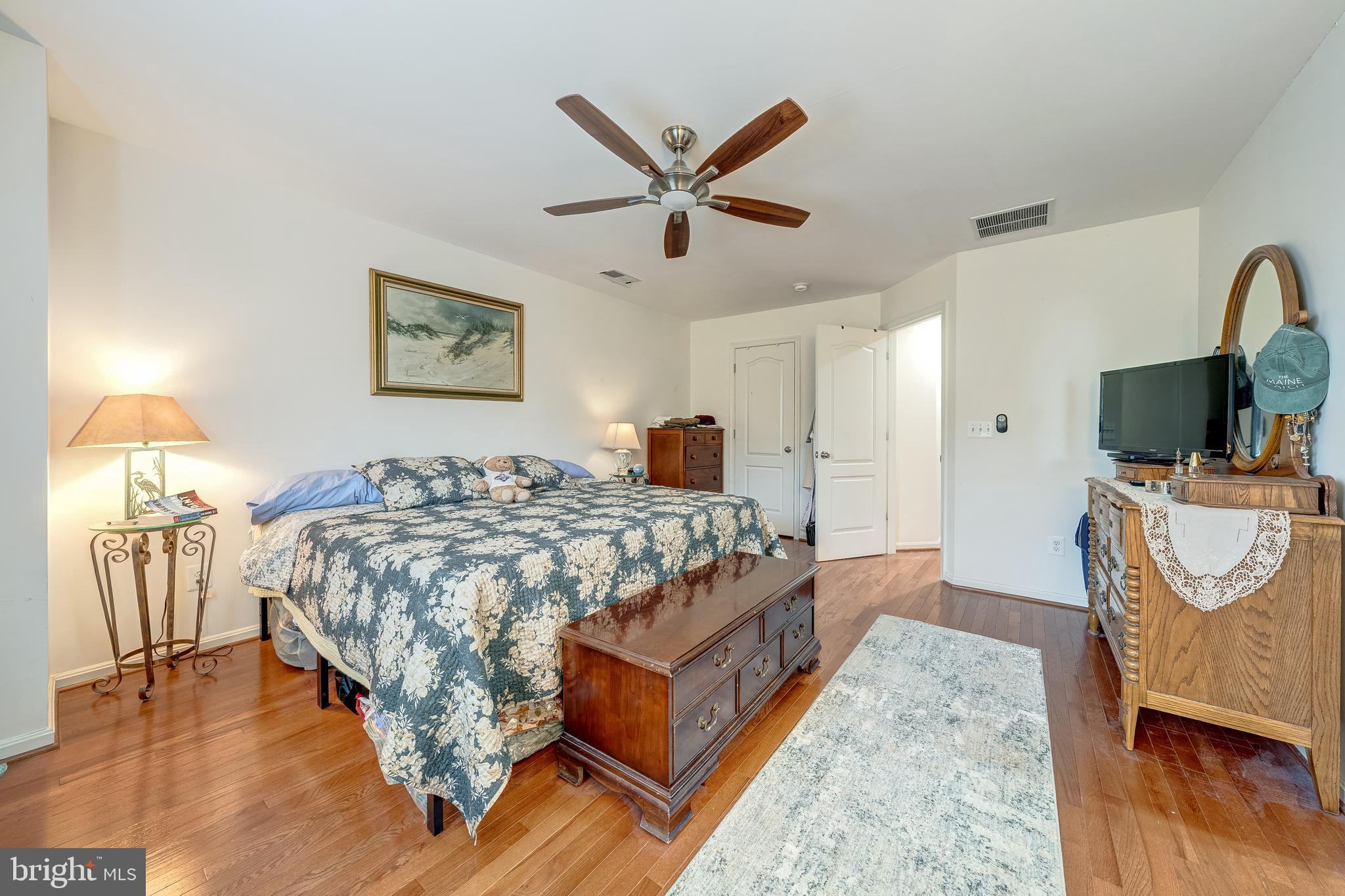 22644 Amberjack Square Brambleton, VA 20148 - Photo 23 of 34 a bedroom with a bed and a flat screen tv