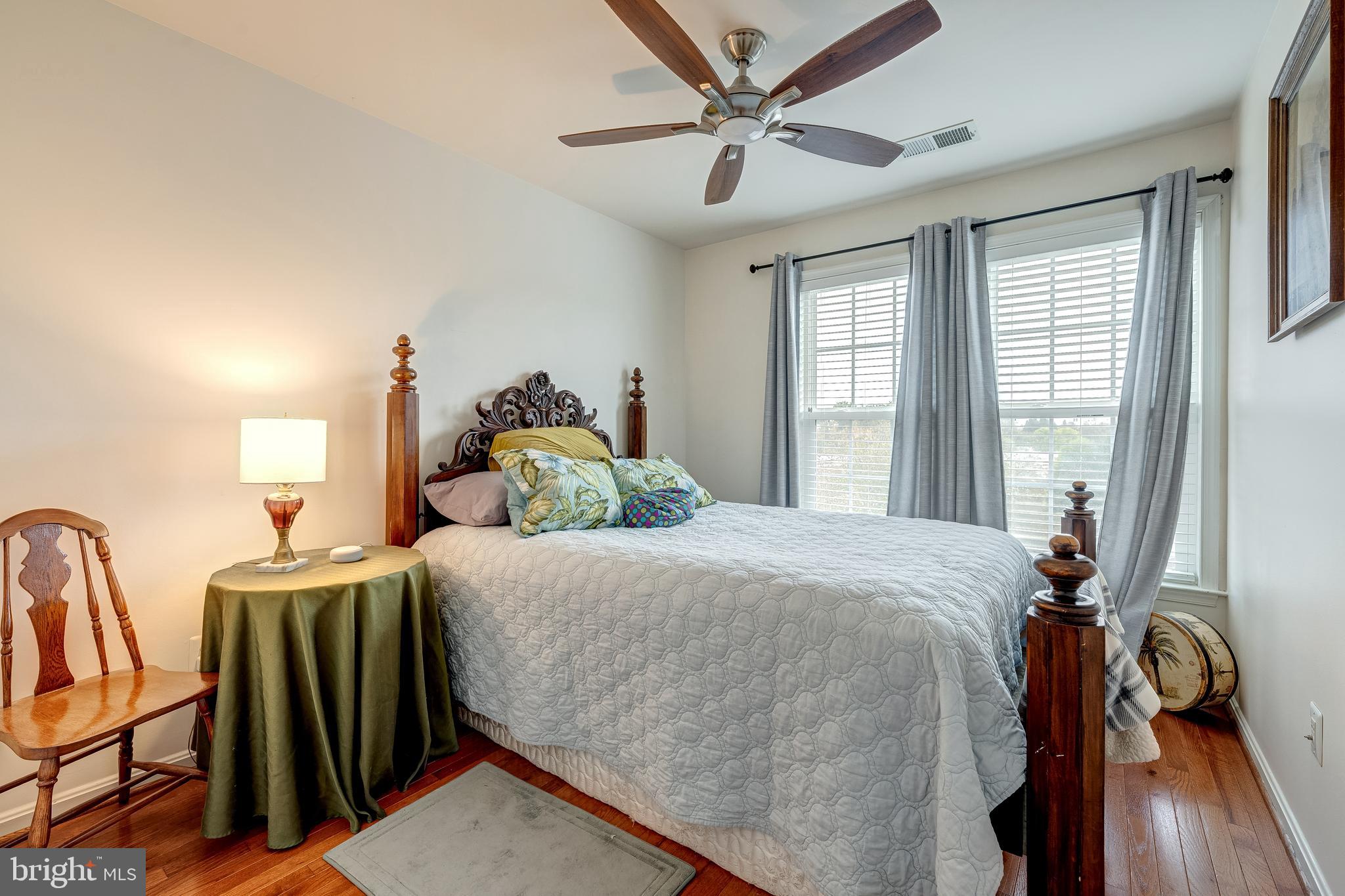 22644 Amberjack Square Brambleton, VA 20148 - Photo 26 of 34 a bed sitting in a bedroom next to a window