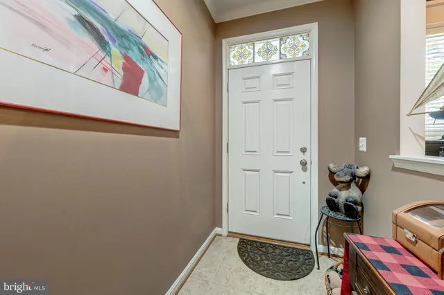 a view of entryway and gallery with wooden floor