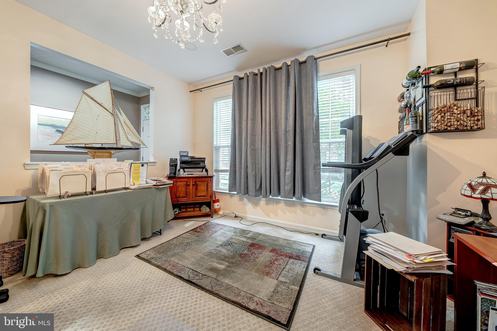 22644 Amberjack Square Brambleton, VA 20148 - Photo 31 of 34 a living room with furniture and a window