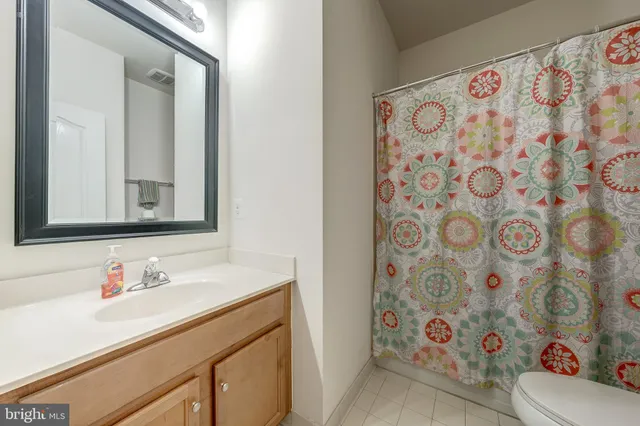 a couple of cars parked in front of a house