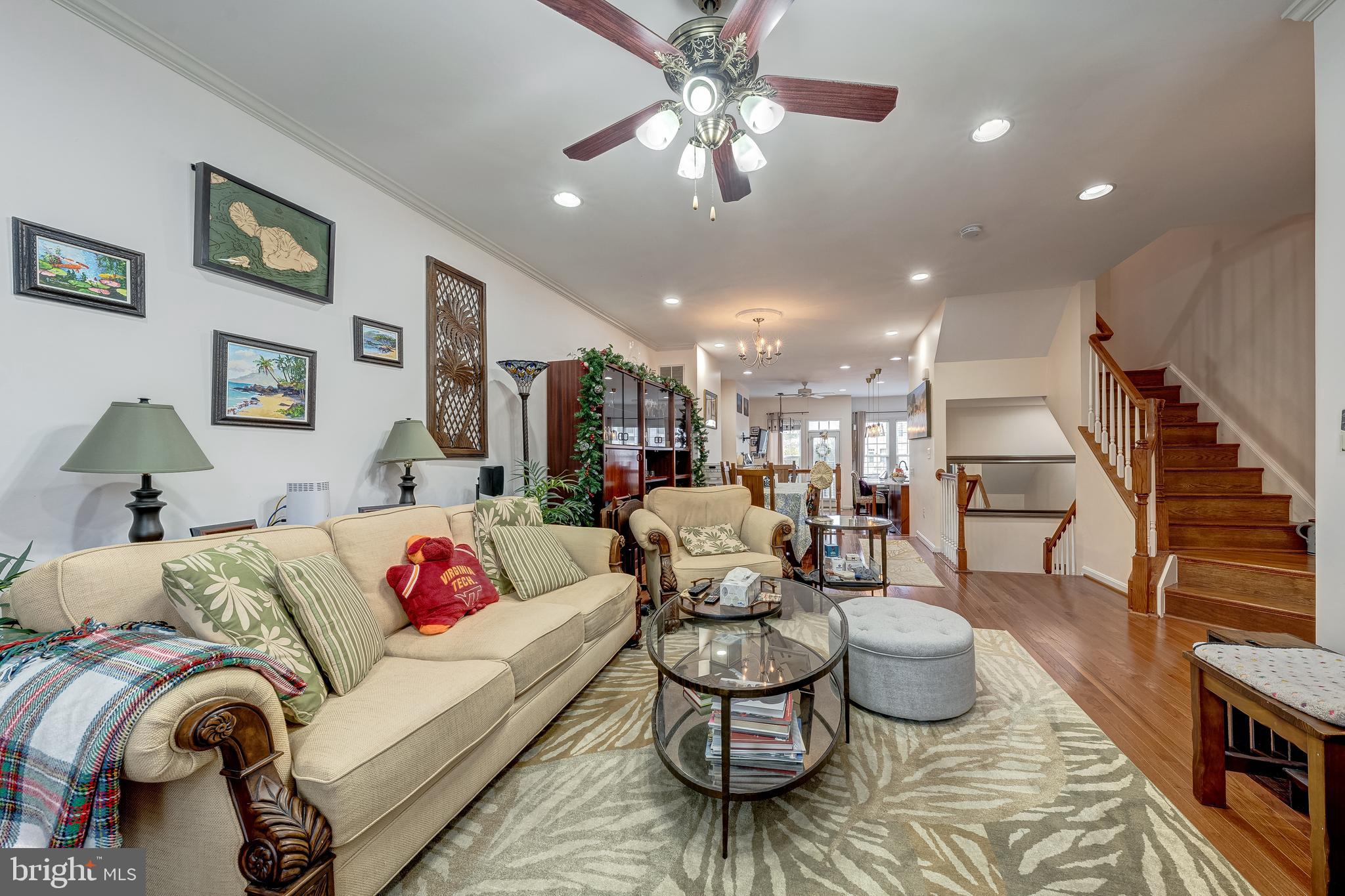 22644 Amberjack Square Brambleton, VA 20148 - Photo 6 of 34 a living room with furniture and wooden floor