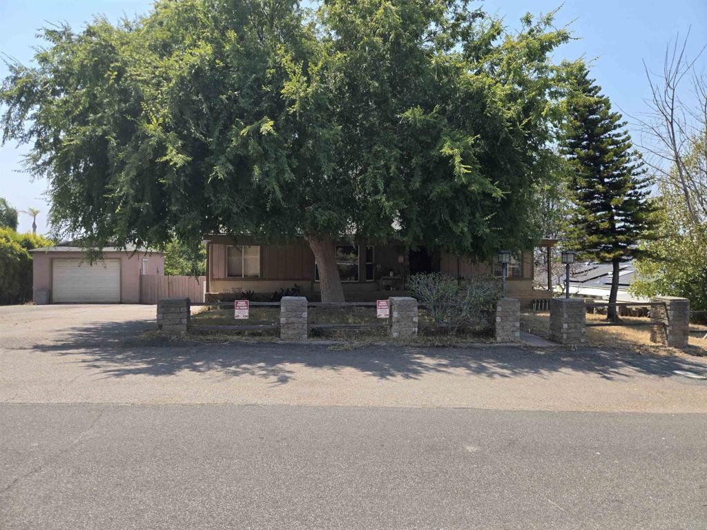 3560 Ybarra Road Spring Valley, CA 91978 - Photo 1 of 1 a view of a house with a tree in the background
