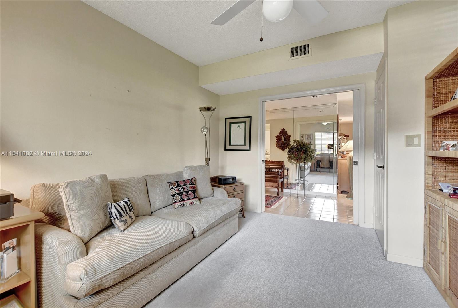 7602 Elm Ridge Drive, Unit 4L Boca Raton, FL 33433 - Photo 19 of 44 a living room with furniture and a wooden floor