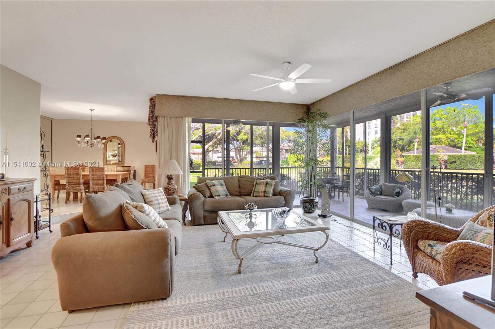 7602 Elm Ridge Drive, Unit 4L Boca Raton, FL 33433 - Photo 4 of 44 a living room with furniture and a large window