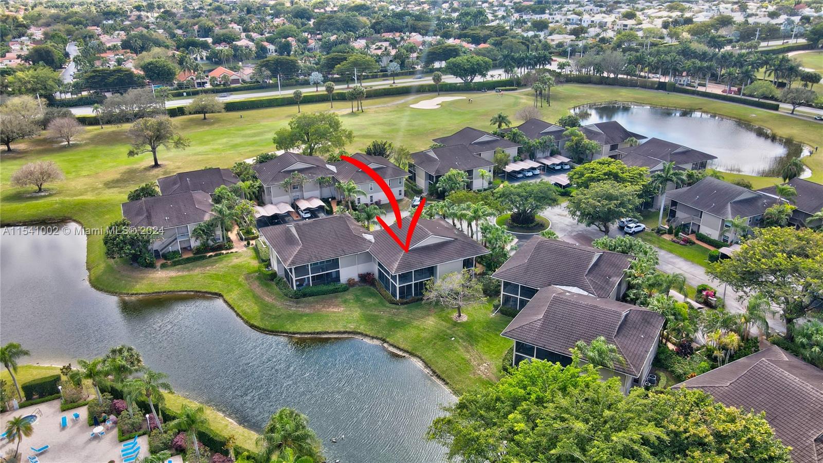 7602 Elm Ridge Drive, Unit 4L Boca Raton, FL 33433 - Photo 41 of 44 an aerial view of house swimming pool yard and lake view