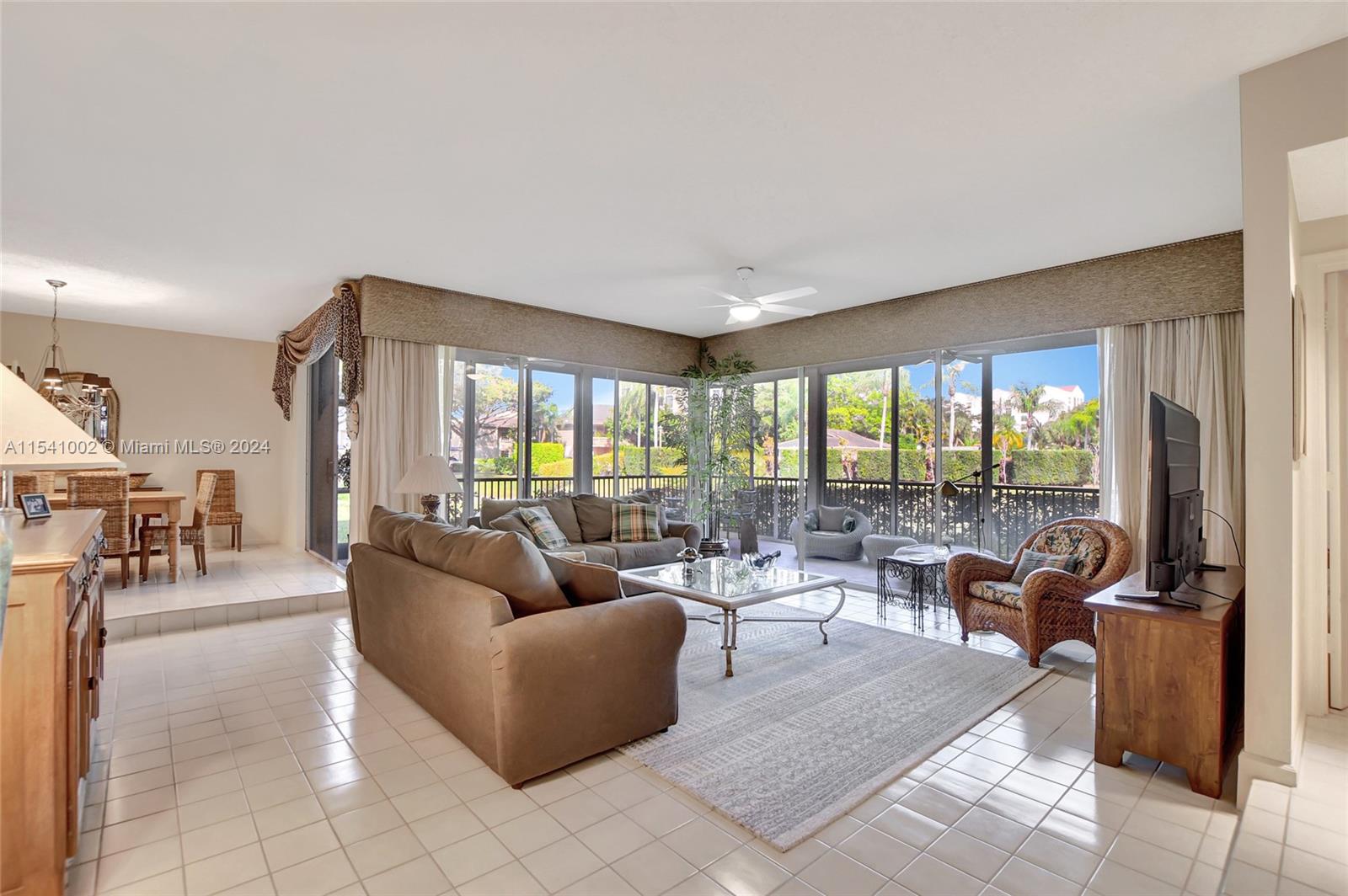 7602 Elm Ridge Drive, Unit 4L Boca Raton, FL 33433 - Photo 5 of 44 a living room with furniture and a large window