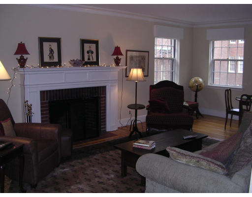 37 Beacon Street, Unit 56 Boston, MA 02108 - Photo 1 of 1 a living room with furniture and a fireplace