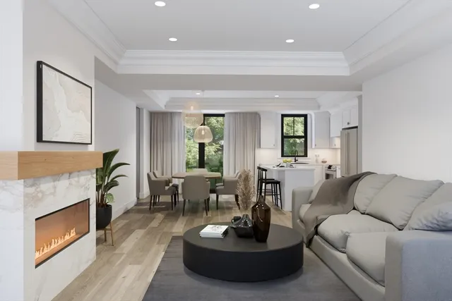 a living room with furniture a window and a fireplace