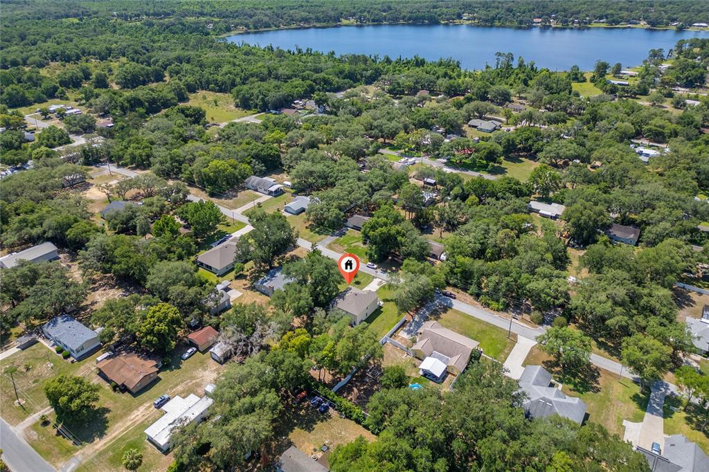 4331 Wayne Road Fruitland Park, FL 34731 - Photo 10 of 46 an aerial view of a house with a yard and lake view