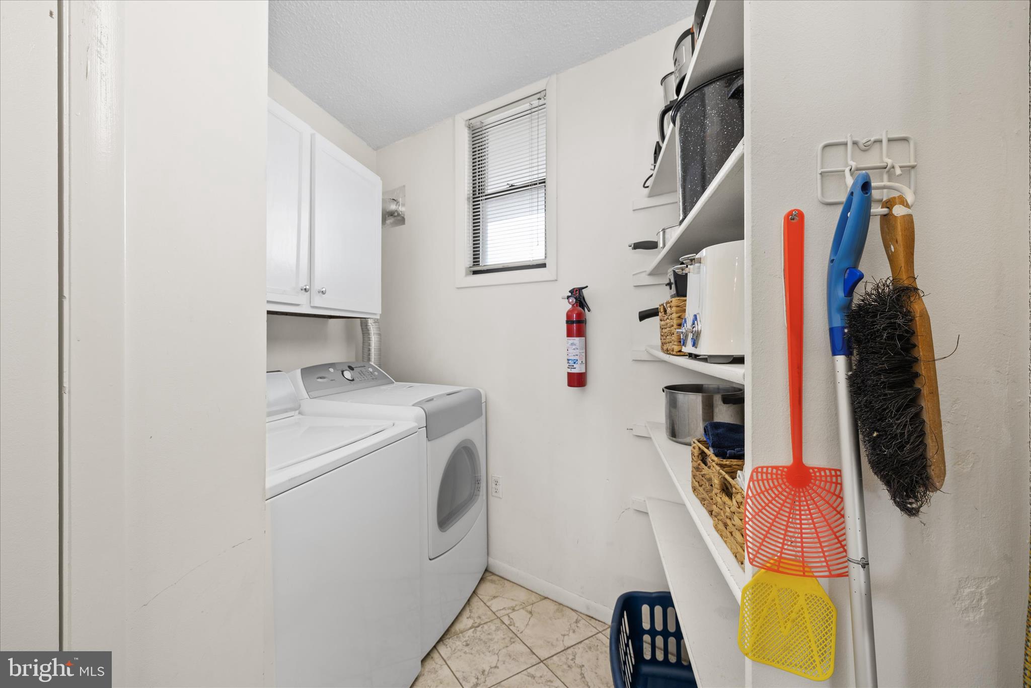 603 North Edgewater House Road, Unit 603N Bethany Beach, DE 19930 - Photo 16 of 40 a view of walk in closet with clothes washer and dryer