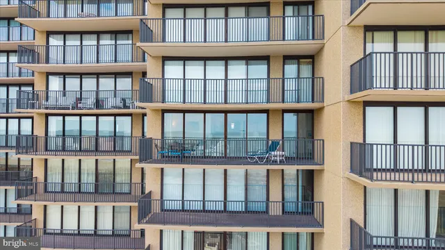 a view of a brick building and a small gate