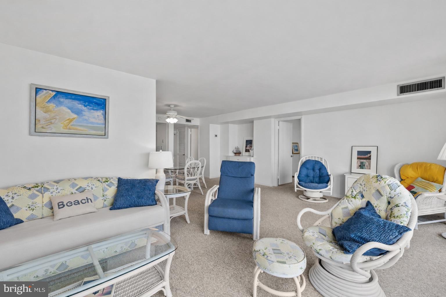 603 North Edgewater House Road, Unit 603N Bethany Beach, DE 19930 - Photo 4 of 41 a living room with furniture and wooden floor