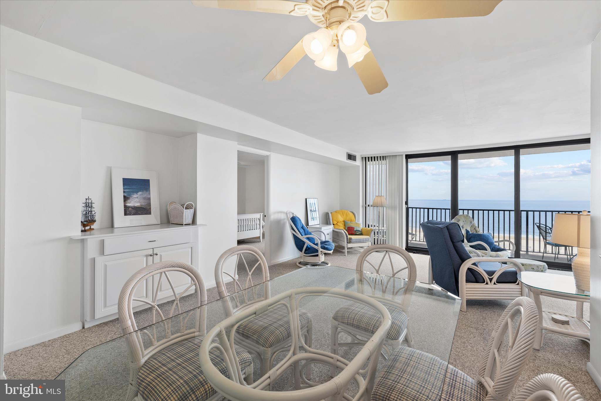 603 North Edgewater House Road, Unit 603N Bethany Beach, DE 19930 - Photo 5 of 40 a living room with furniture a flat screen tv and a large window
