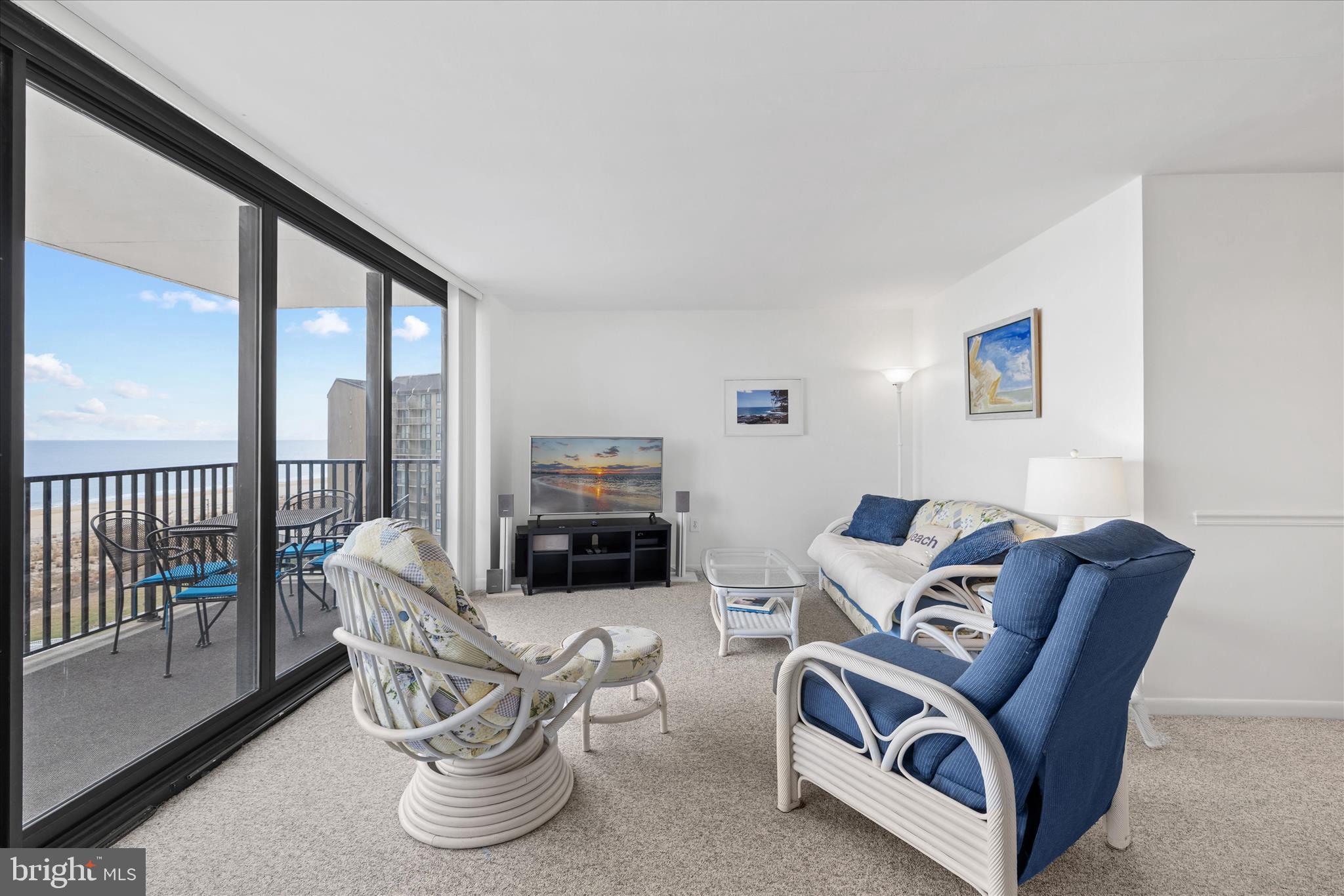 603 North Edgewater House Road, Unit 603N Bethany Beach, DE 19930 - Photo 6 of 40 a living room with furniture a rug and a large window