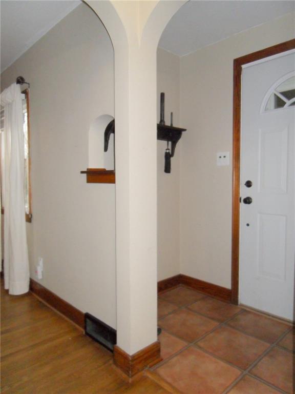824 Old Thorn Run Road Coraopolis, PA 15108 - Photo 22 of 25 6x4 Foyer, Front Door with Arched Opening, Open Shelf for Keys, and Coat Closet (to Right, not Shown in Photo)