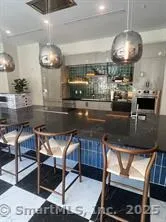 a kitchen with a table and chairs in it