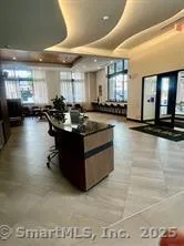 a large kitchen with stainless steel appliances and a large window