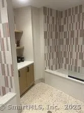 a view of a two chairs in the patio