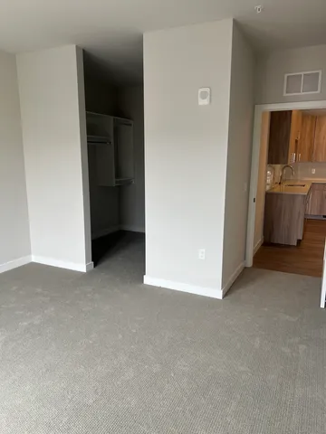 a view of a kitchen cabinets and a utility room