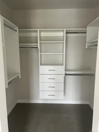 a view of an empty walk in closet