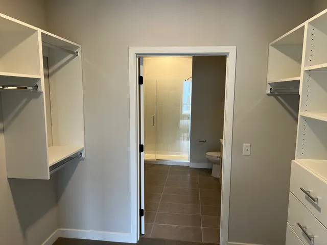a bathroom with a glass shower door