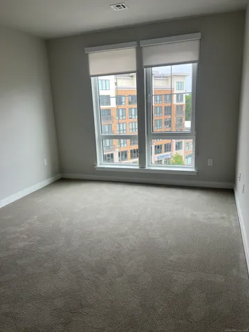 an empty room with a windows