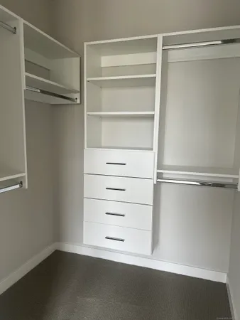 a view of an empty walk in closet